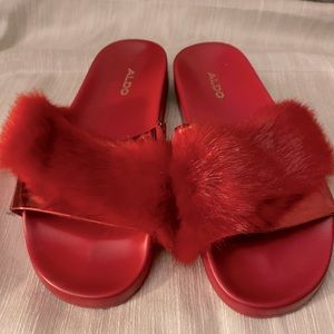 Red Aldo brand furry slides